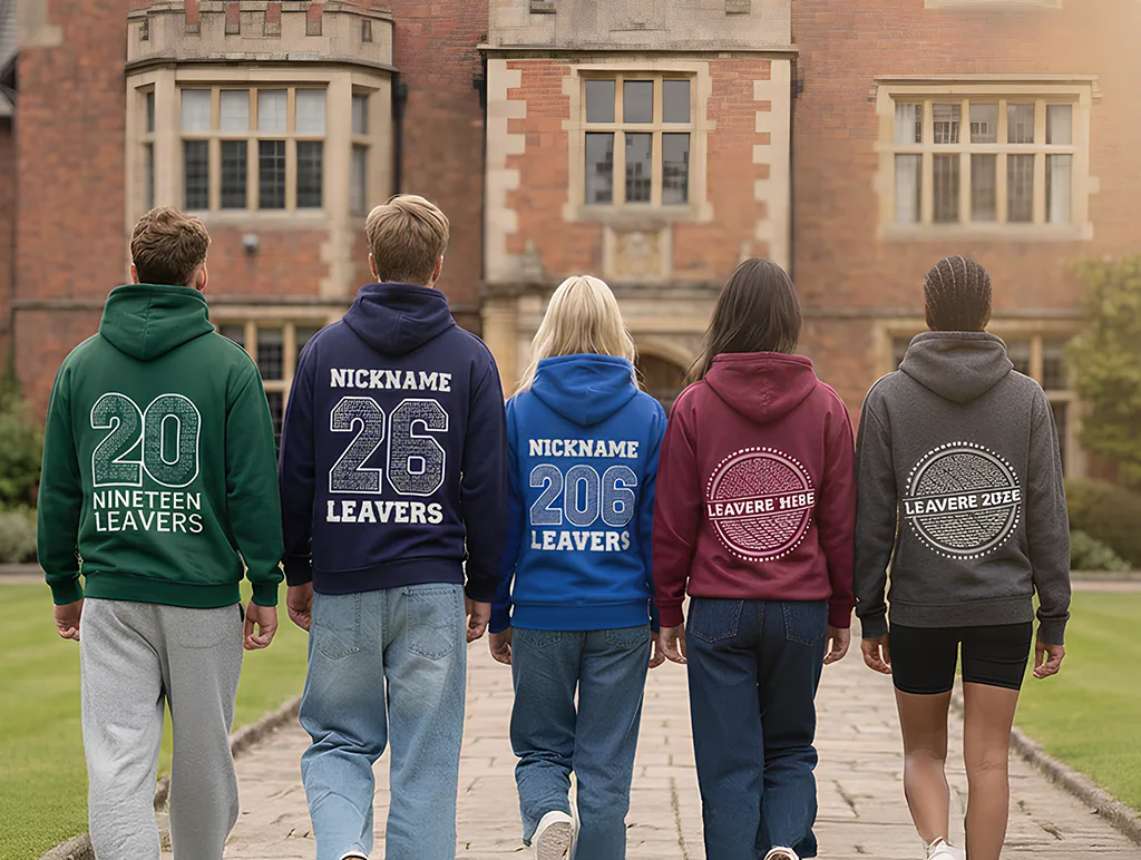 University students holding yearbooks